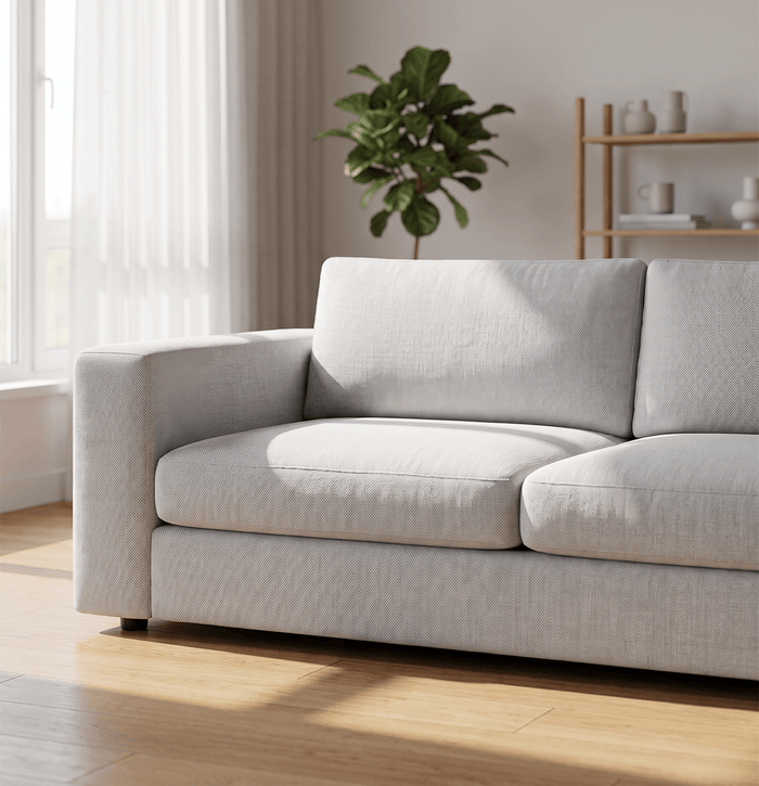 Light-colored fabric sofa in a bright living room