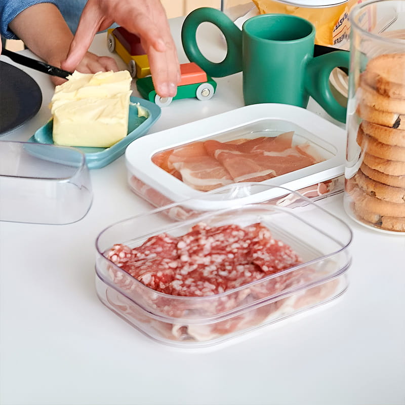 Food organized in transparent refrigerator storage container